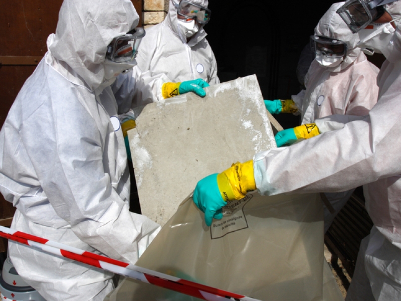 Removing materials containing some asbestos