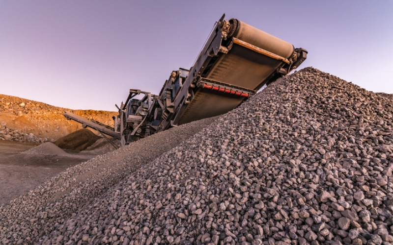 Surface mine with machinery to transform the stone into gravel